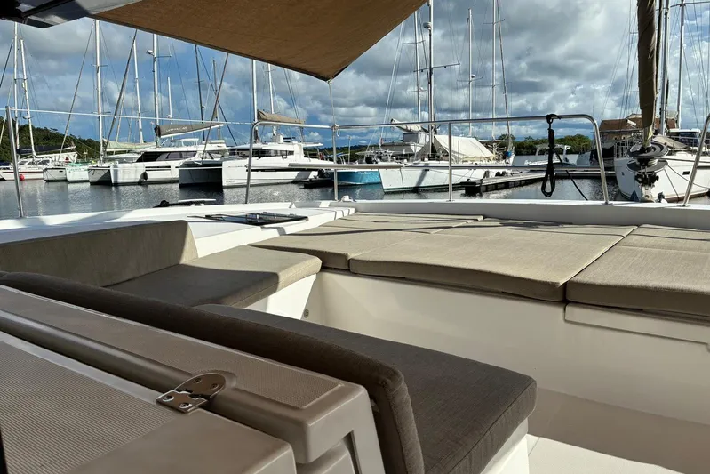 Isthmus Breeze Yacht Photos Pics Luxurious 2023 Bali 4.2 yacht interior with marina view and comfortable seating.