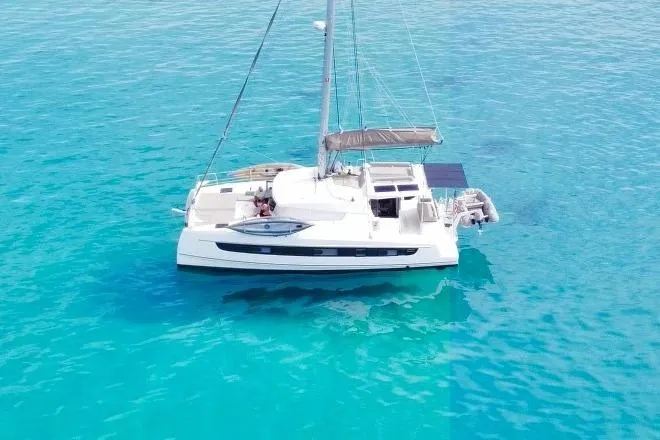 Isthmus Breeze Yacht Photos Pics 2023 Bali 4.2 catamaran sailing on clear turquoise waters.
