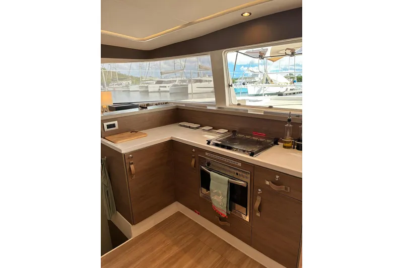 Isthmus Breeze Yacht Photos Pics Modern kitchen interior on 2023 Bali 4.2 yacht with stove and scenic window view.