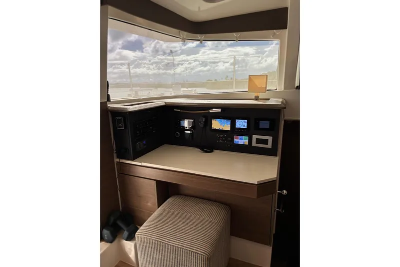 Isthmus Breeze Yacht Photos Pics Modern helm station in 2023 Bali 4.2 yacht with navigation equipment and panoramic window view.