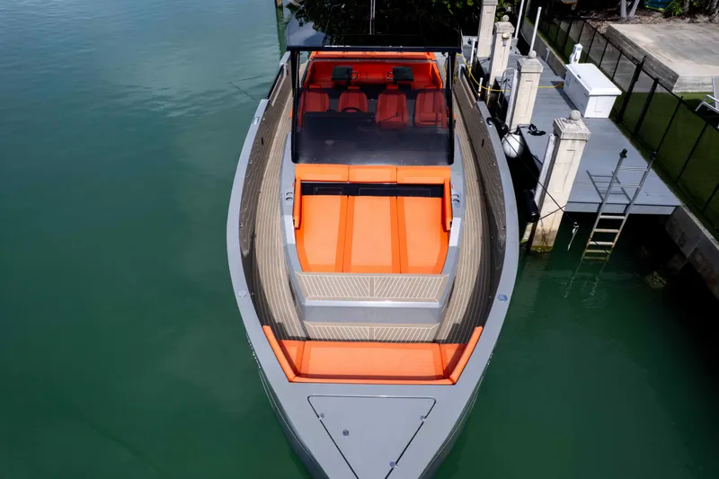  Yacht Photos Pics 2023 De Antonio Yachts D50 with sleek design and vibrant orange seating.