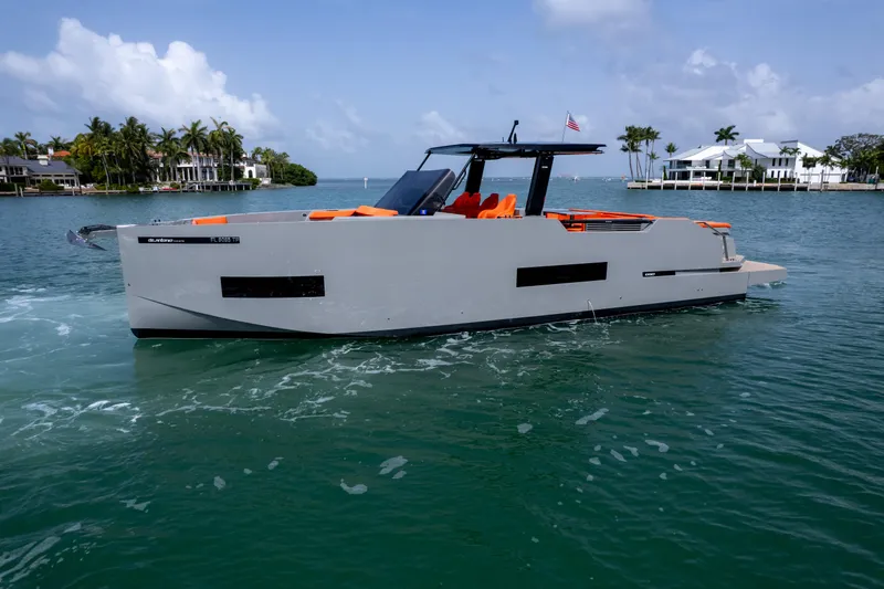  Yacht Photos Pics 2023 De Antonio Yachts D50 cruising in a scenic coastal area with modern design.