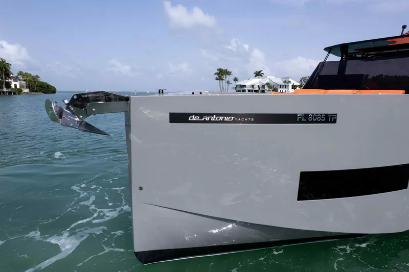  Yacht Photos Pics 2023 De Antonio Yachts D50, sleek design, anchored in calm waters, modern luxury yacht.