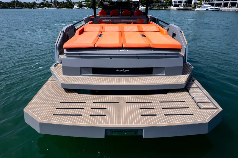  Yacht Photos Pics 2023 De Antonio Yachts D50 with orange sunbeds and spacious deck on the water.