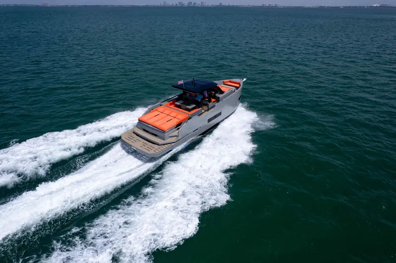  Yacht Photos Pics 2023 De Antonio Yachts D50 cruising on open water, showcasing sleek design and performance.