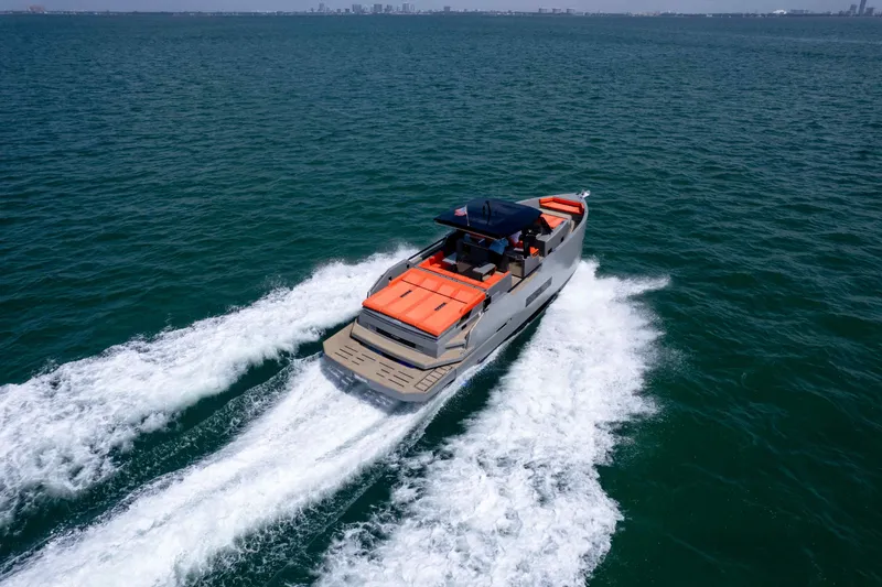  Yacht Photos Pics 2023 De Antonio Yachts D50 cruising on open water, showcasing sleek design and performance.