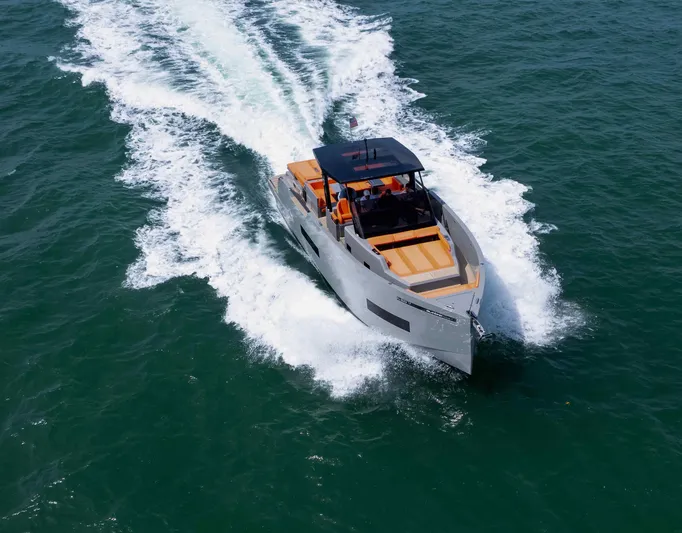  Yacht Photos Pics 2023 De Antonio Yachts D50 cruising on open water, showcasing sleek design and performance.