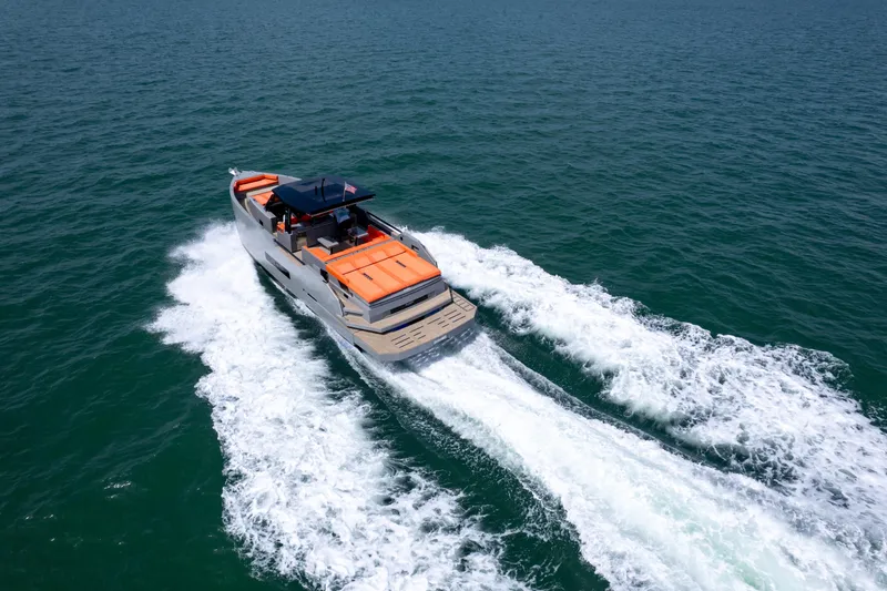  Yacht Photos Pics 2023 De Antonio Yachts D50 cruising on open water, showcasing sleek design and powerful performance.