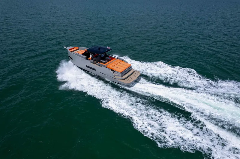  Yacht Photos Pics 2023 De Antonio Yachts D50 cruising on open water, showcasing sleek design and performance.