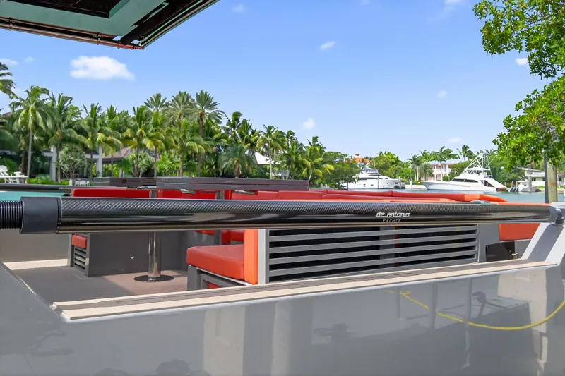  Yacht Photos Pics 2023 De Antonio Yachts D50 with sleek design, docked near tropical scenery.