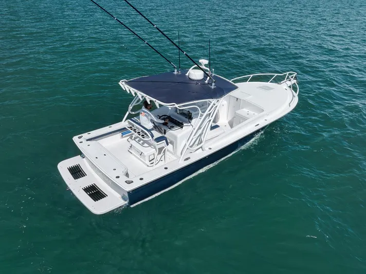  Yacht Photos Pics 2003 Strike 31 Open boat on clear blue water, featuring a sleek design and fishing equipment.