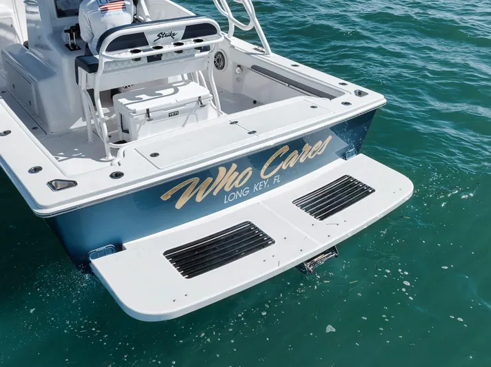  Yacht Photos Pics 2003 Strike 31 Open boat on water, named "Who Cares," Long Key, FL.