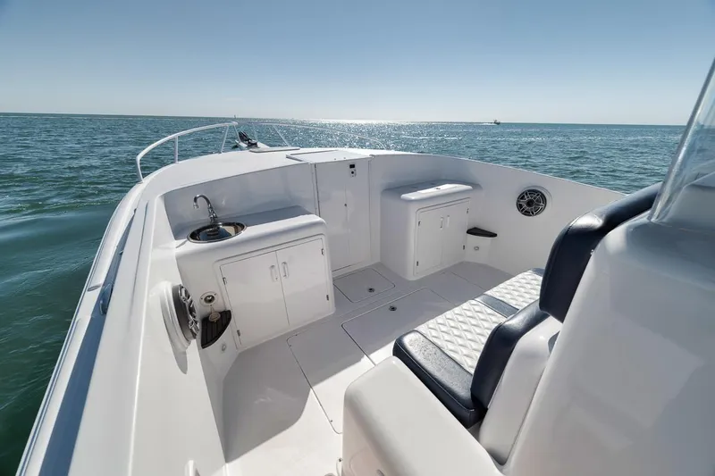  Yacht Photos Pics 2003 Strike 31 Open boat interior with seating and ocean view.