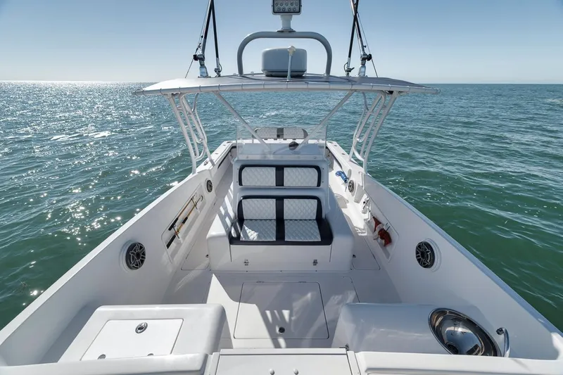  Yacht Photos Pics 2003 Strike 31 Open boat on calm ocean waters under clear blue sky.