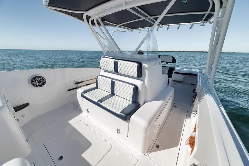  Yacht Photos Pics 2003 Strike 31 Open boat interior with cushioned seating and ocean view.