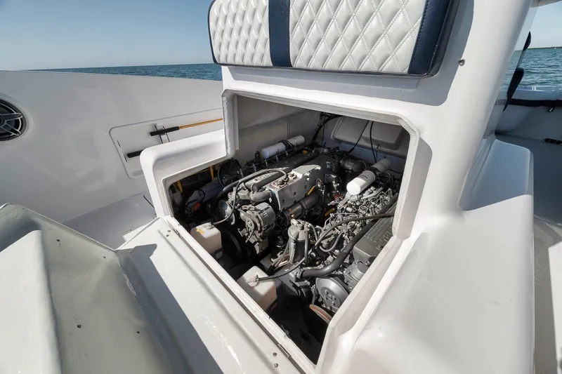  Yacht Photos Pics Engine compartment of a 2003 Strike 31 Open boat, showcasing detailed mechanical components.