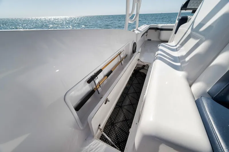  Yacht Photos Pics 2003 Strike 31 Open boat interior with fishing rod storage, ocean view.