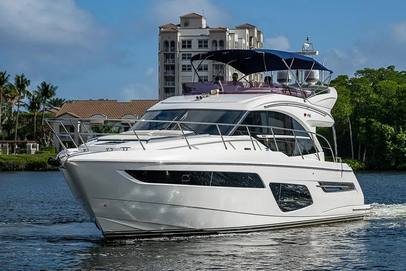  Yacht Photos Pics Luxury 2022 Princess F50 yacht cruising on a scenic waterway.