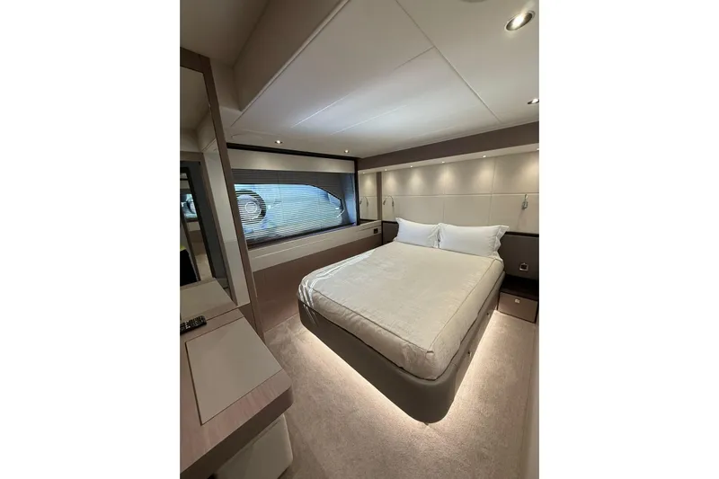 Svetlana Yacht Photos Pics Luxurious bedroom interior of 2025 Sunseeker 76 Yacht with modern design and ambient lighting.