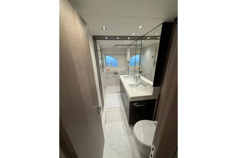Svetlana Yacht Photos Pics Luxurious bathroom interior of 2025 Sunseeker 76 Yacht with modern fixtures and elegant design.