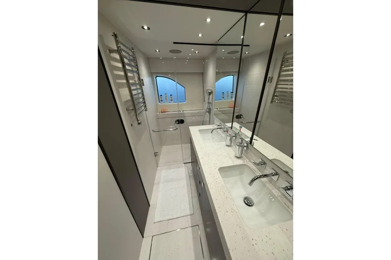 Svetlana Yacht Photos Pics Luxurious bathroom in 2025 Sunseeker 76 Yacht with dual sinks and modern fixtures.