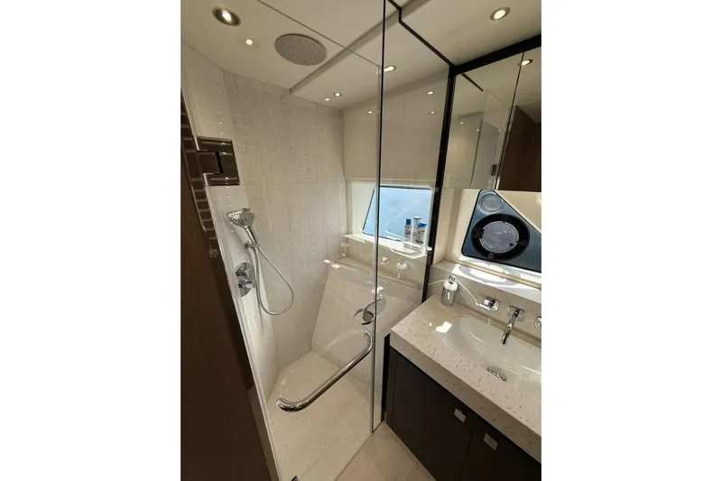 Svetlana Yacht Photos Pics Luxurious bathroom in 2025 Sunseeker 76 Yacht with modern fixtures and elegant design.