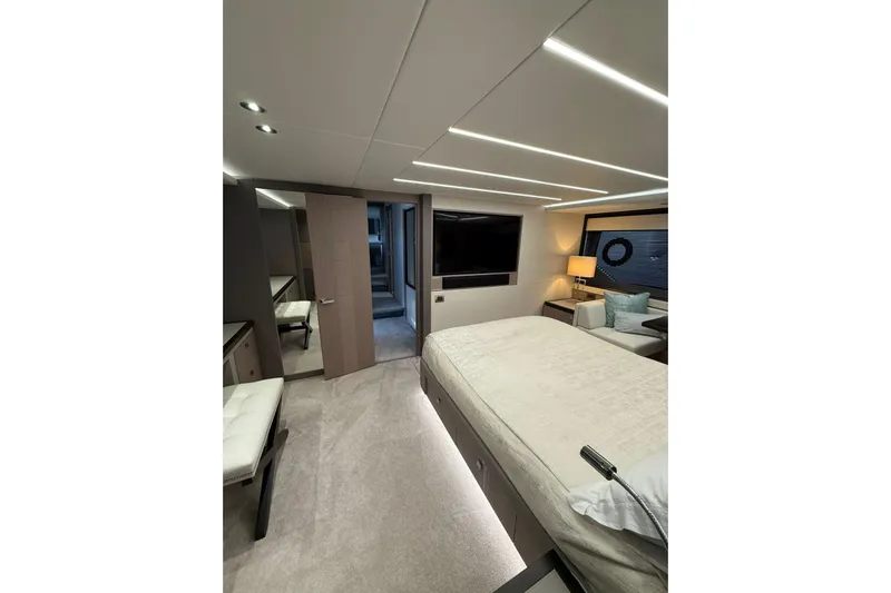 Svetlana Yacht Photos Pics Luxurious interior of 2025 Sunseeker 76 Yacht bedroom with modern design and ambient lighting.