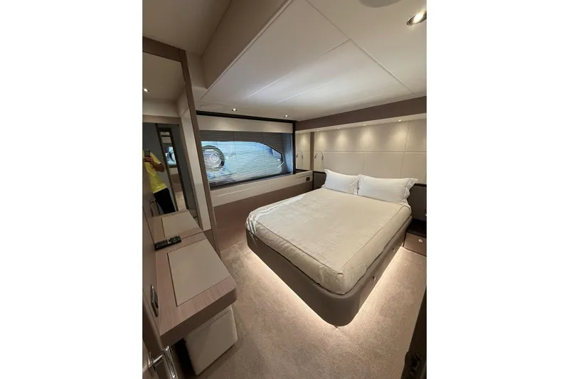 Svetlana Yacht Photos Pics Luxurious bedroom interior of 2025 Sunseeker 76 Yacht with modern design and ambient lighting.