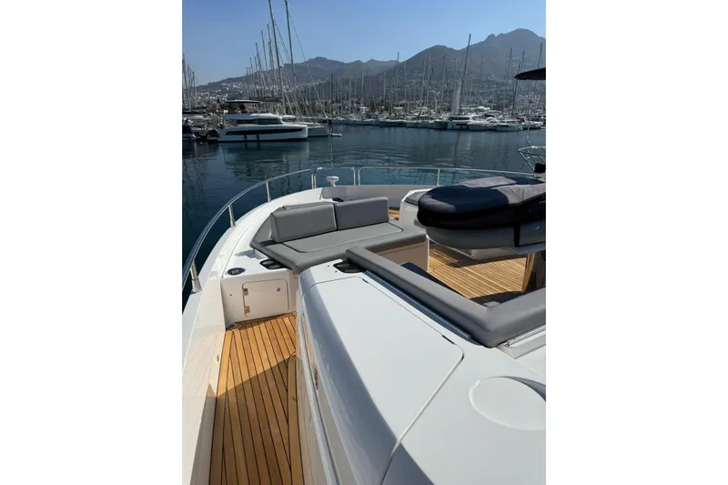 Svetlana Yacht Photos Pics Luxurious 2025 Sunseeker 76 Yacht with spacious deck and marina view.