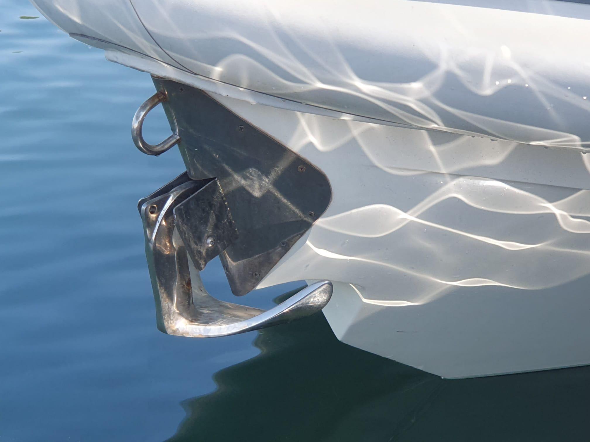 Boat anchor detail with water reflections, captured by Scanner Dillenium 2999, 2010.
