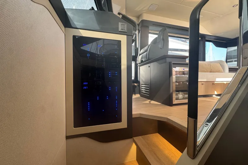  Yacht Photos Pics Interior of 2023 Absolute 52 FLY yacht, featuring modern design and luxurious seating.