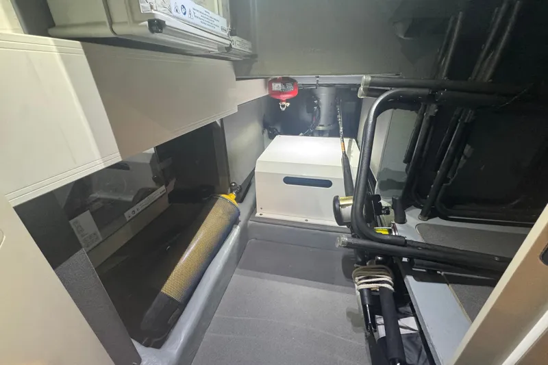  Yacht Photos Pics Interior of 2023 Absolute 52 FLY yacht, showcasing storage and equipment space.