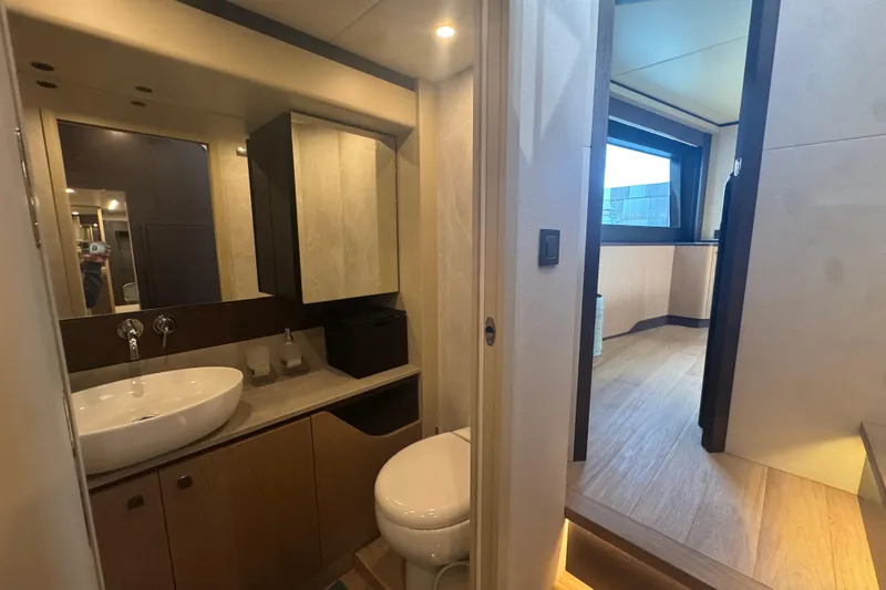  Yacht Photos Pics Luxurious bathroom interior of 2023 Absolute 52 FLY yacht, featuring modern fixtures and elegant design.