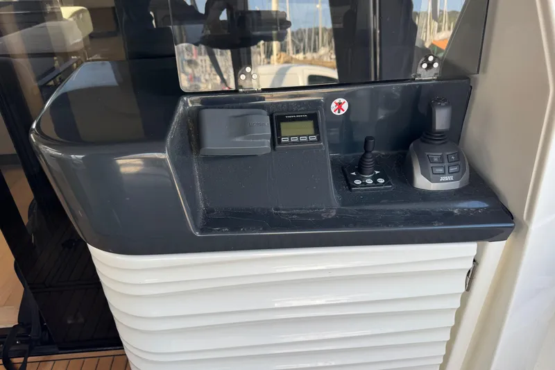  Yacht Photos Pics Control panel of 2023 Absolute 52 FLY yacht with joystick and display.