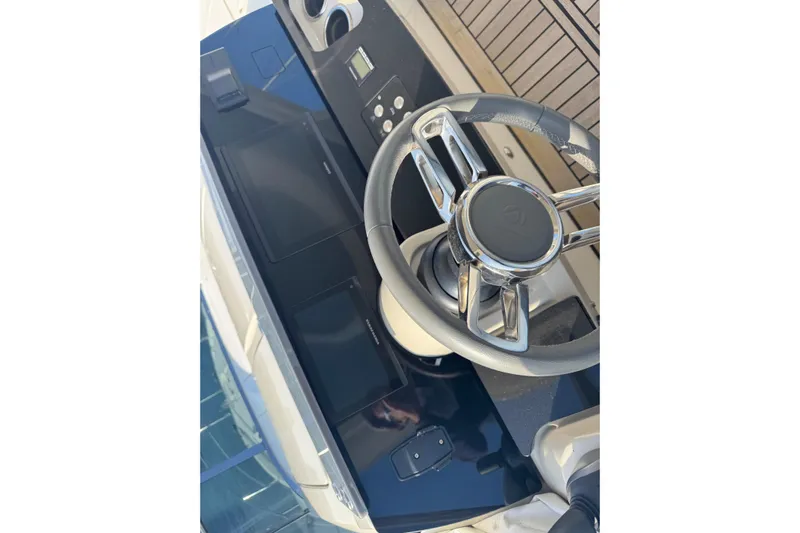  Yacht Photos Pics Steering wheel and dashboard of 2023 Absolute 52 FLY yacht.