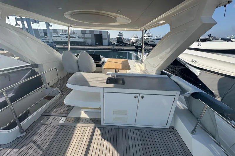  Yacht Photos Pics Luxurious 2023 Absolute 52 FLY yacht interior with modern amenities and sleek design.