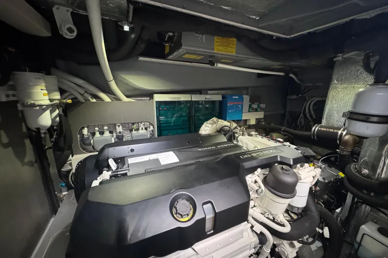  Yacht Photos Pics Engine room of 2023 Absolute 52 FLY yacht, featuring advanced mechanical systems.