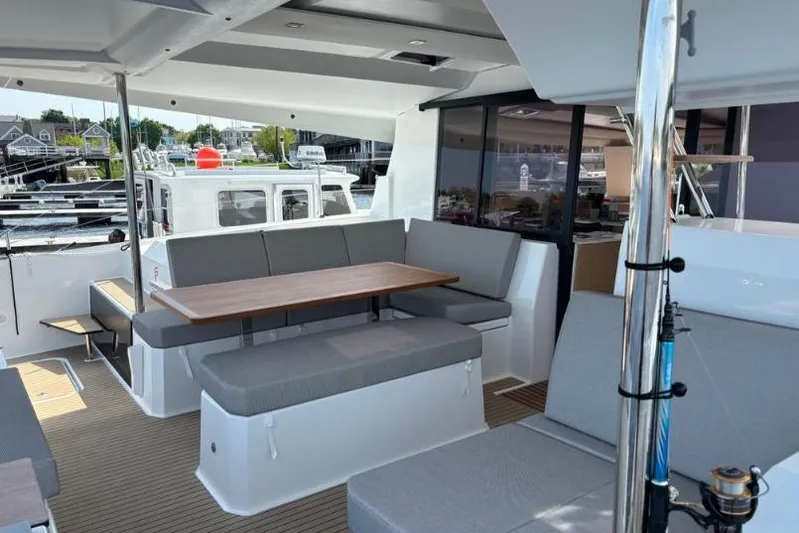 White Cap IV Yacht Photos Pics 2024 Fountaine Pajot Astrea 42 yacht with spacious outdoor seating and dining area.