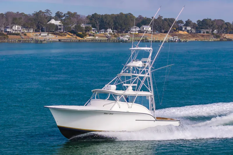 Carry On Yacht Photos Pics 2003 Custom Carolina Layton Express boat on the water.