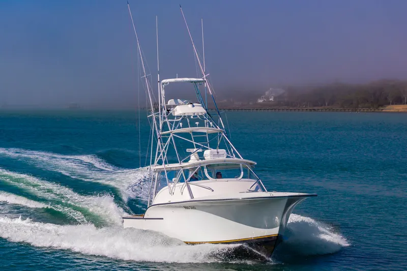 Carry On Yacht Photos Pics 2003 Custom Carolina Layton Express boat on the water.