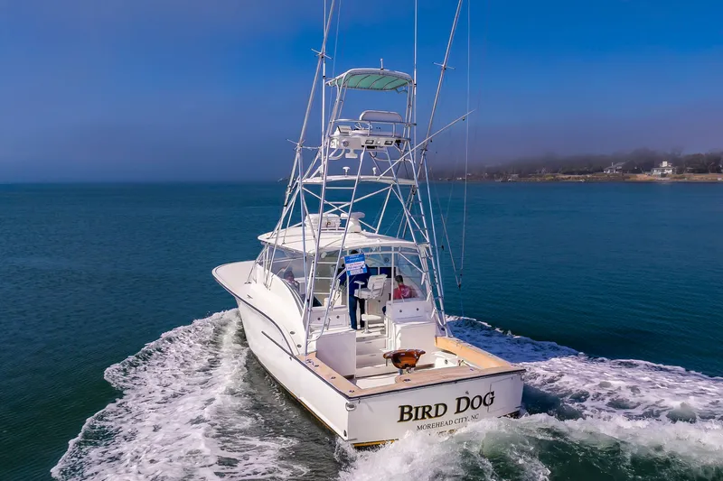 Carry On Yacht Photos Pics 2003 Custom Carolina Layton Express on water, rear view.