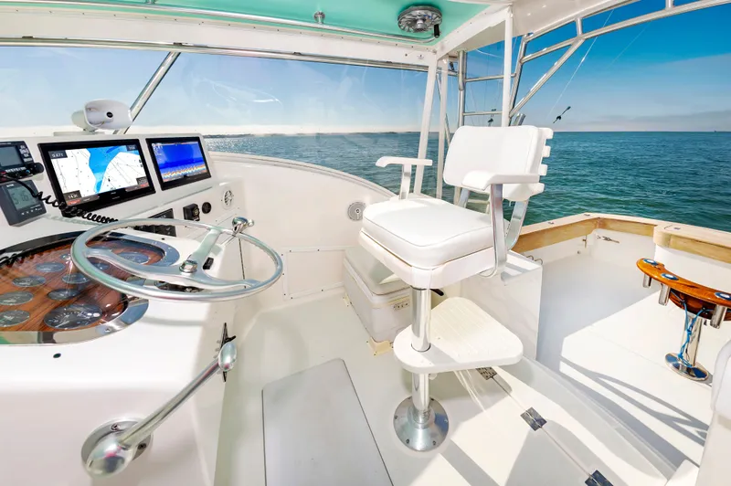 Carry On Yacht Photos Pics Helm of the 2003 Custom Carolina Layton Express yacht.