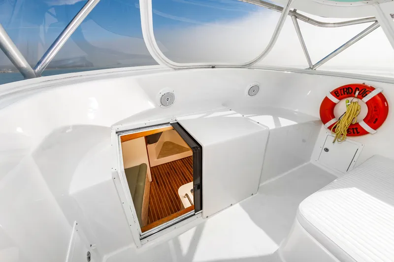 Carry On Yacht Photos Pics 2003 Custom Carolina Layton Express boat cabin with lifebuoy.
