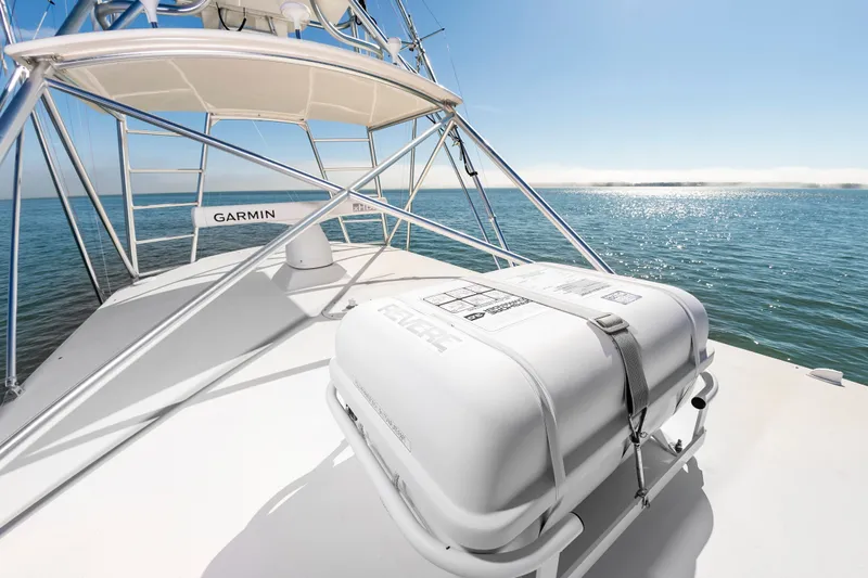 Carry On Yacht Photos Pics 2003 Custom Carolina Layton Express on calm sea under sunny sky.