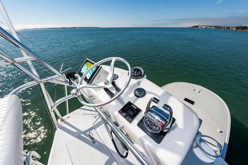 Carry On Yacht Photos Pics Helm of 2003 Custom Carolina Layton Express on open sea.