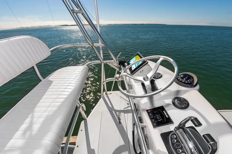 Carry On Yacht Photos Pics Helm of 2003 Custom Carolina Layton Express on open sea.