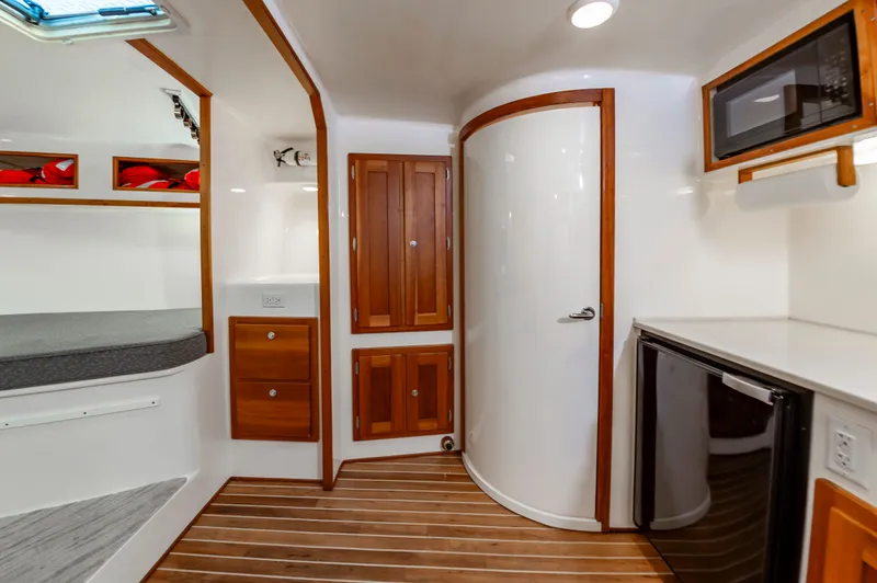 Carry On Yacht Photos Pics Interior of 2003 Custom Carolina Layton Express with wood accents.