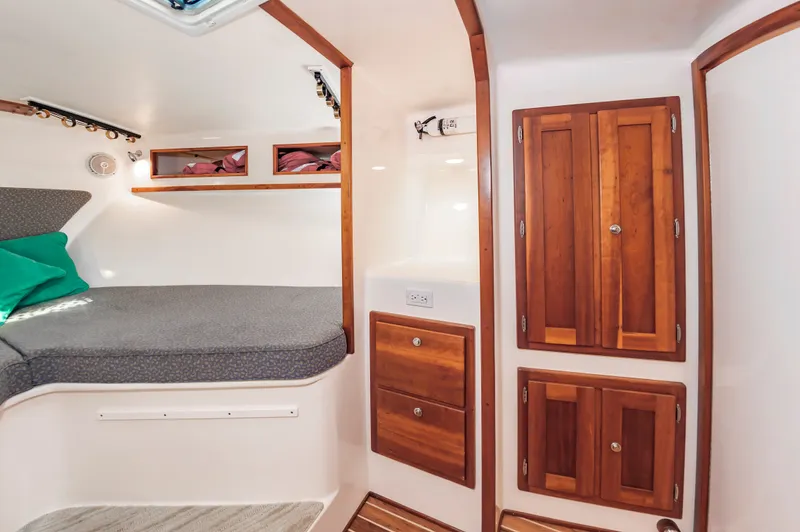 Carry On Yacht Photos Pics 2003 Custom Carolina Layton Express interior with wooden cabinetry.