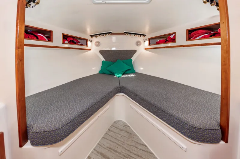 Carry On Yacht Photos Pics Interior of 2003 Custom Carolina Layton Express with cozy bed.
