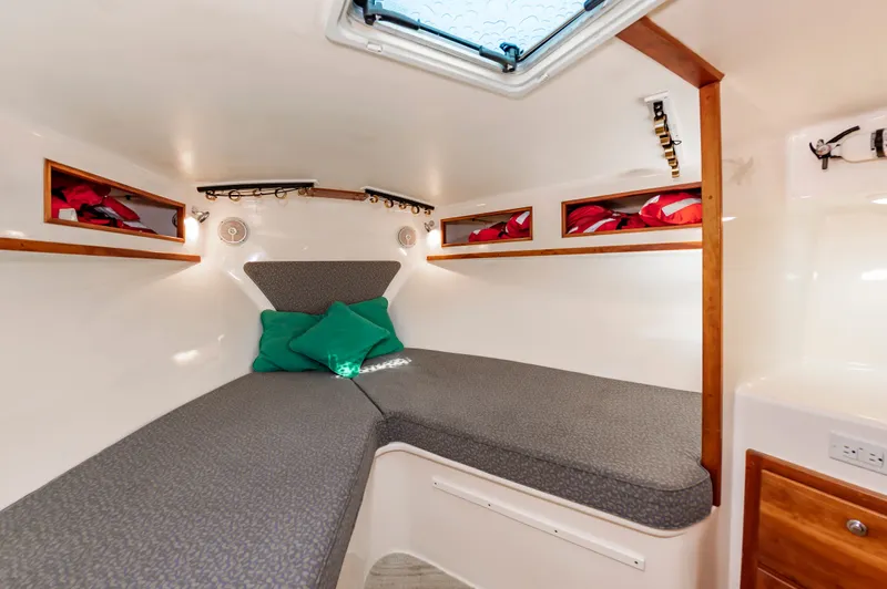 Carry On Yacht Photos Pics Interior of 2003 Custom Carolina Layton Express with cozy bed.
